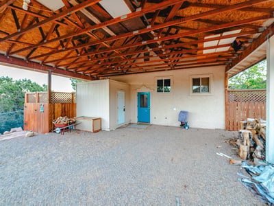 This oversized covered area provides ample room for vehicles, equipment, and storage. Durable construction supports practical day-to-day living across the home s acreage.
