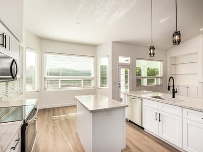 Bright Scottsdale dining area adjacent to the updated kitchen with large windows and views of the backyard. The open layout and modern finishes create an inviting environment for meals and gatherings.