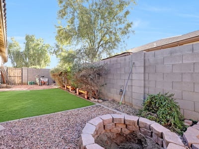 Artificial turf side yard designed for easy care and everyday use, perfect for pets or outdoor activities.