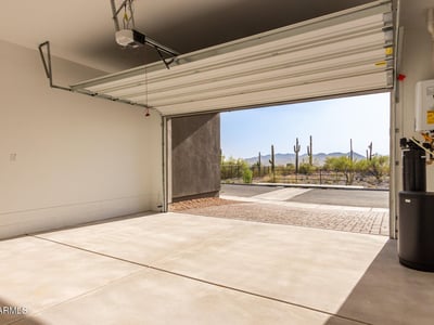 Finished garage interior with clean lines and open space, offering room for parking, storage, or hobbies.