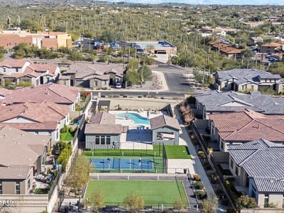 Scenic overview of shared community amenities surrounded by desert landscaping and mountain views, enhancing the neighborhood lifestyle.