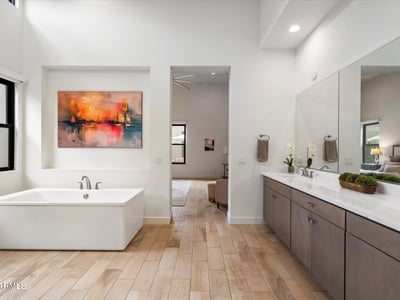 Modern primary bath highlighting a freestanding tub and serene design. This Scottsdale luxury bathroom delivers spa-style comfort and timeless elegance.