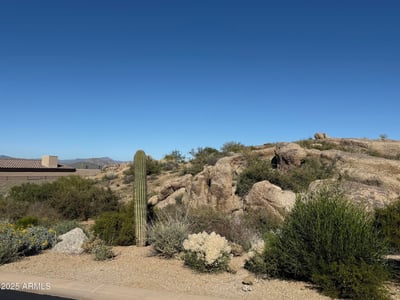 View of nearby modern homes illustrating the cohesive design, upscale feel, and desert setting of the Sereno Canyon community.