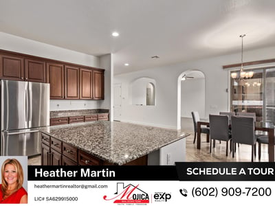 Featuring a gas cooktop, built-in microwave, and granite counters, this kitchen is designed for efficiency. The generous storage and prep space make it a standout in this Glendale pool home.