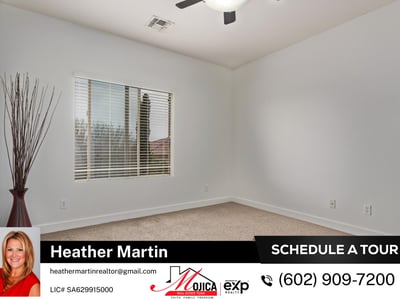 This well-lit bedroom includes a ceiling fan and generous window views. Part of a spacious Glendale home offering modern layout and private backyard pool.