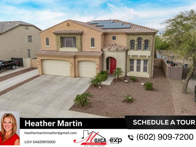 This drone perspective highlights dual garage doors, desert landscaping, and solar energy features. Located in Glendale, the home offers both efficiency and standout architecture.