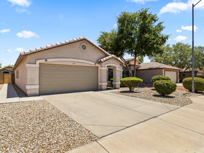 Overhead perspective showcasing the home's lot size, backyard space, and surrounding homes in a well-established Surprise neighborhood.