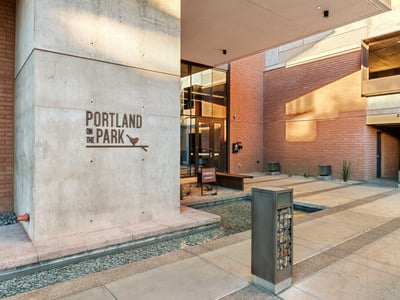 Modern building entrance featuring a sleek water feature, secure access, and updated finishes in Phoenix.