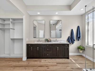 Elegant Scottsdale bathroom with dual sink vanity, quartz surfaces, and custom cabinetry, offering both luxury and convenience.