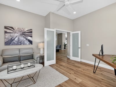 Flexible Scottsdale bonus room with double doors, natural light, and modern finishes, perfect for office or sitting area.
