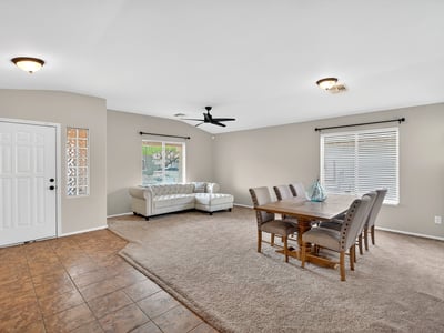 Large living and dining space with high ceilings and natural light. Flexible layout supports entertaining and comfortable living in Casa Grande.