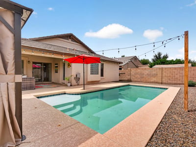 Backyard retreat with pool, patio, and easy-care landscaping. Ideal for relaxing or entertaining in this Casa Grande home.