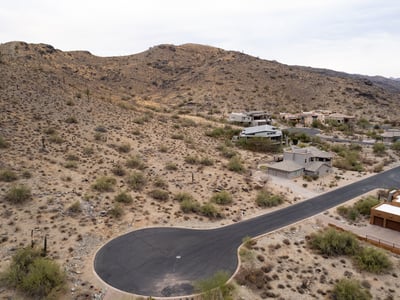 Exceptional hillside lot bordering protected preserve land, offering privacy, scenic desert terrain, and direct access to hiking and biking trails. A rare opportunity to build surrounded by untouched natural beauty.