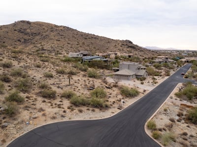 Elevated homesite featuring dramatic mountain backdrops and scenic desert surroundings. Enjoy peaceful hillside living with direct access to nearby hiking trails and outdoor recreation in Phoenix.