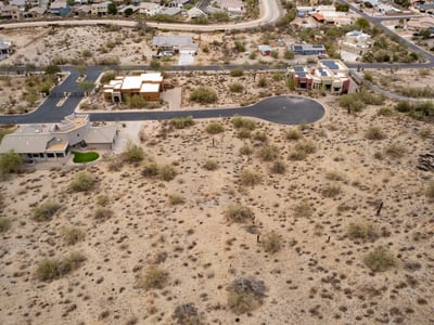 Peaceful hillside neighborhood surrounded by mountain landscapes and upscale custom homes. This elevated Phoenix homesite offers stunning views and a tranquil desert lifestyle.