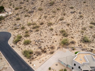 Stunning hillside lot located within the natural desert landscape of Phoenix. Surrounded by mountain scenery and luxury custom homes, this elevated property offers privacy and exceptional build possibilities.