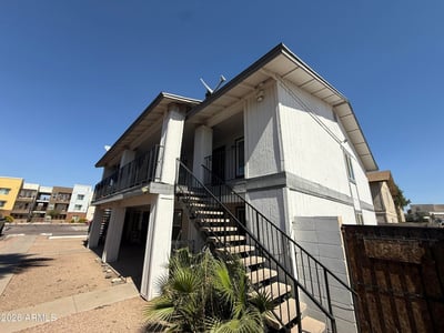 Exterior view of the apartment community featuring covered balconies, upper-level access, and low-maintenance desert landscaping. This Glendale property offers convenience, accessibility, and proximity to popular shopping and entertainment destinations.
