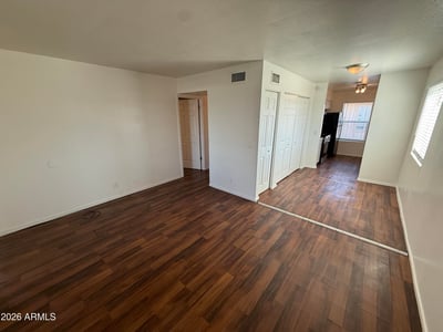 Versatile living space featuring durable flooring, abundant wall space, and an open floor plan. Natural light and flexible room arrangements enhance the home's comfortable and inviting atmosphere.