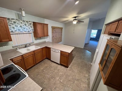 Spacious kitchen with abundant cabinet storage, generous prep areas, and an efficient layout designed for convenience. The open design enhances functionality while maintaining a welcoming atmosphere.