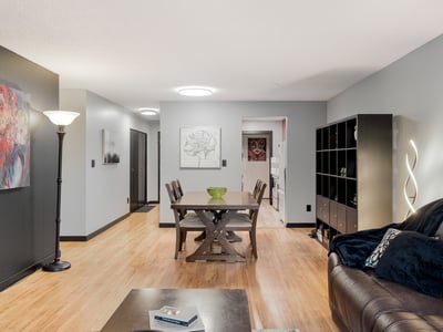 Spacious open-concept living area featuring modern decor and abundant natural light throughout.