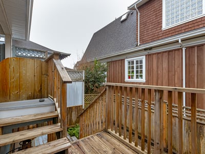 Discover a cozy outdoor space with wood decking, perfect for relaxation or private gatherings.
