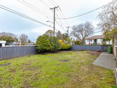 Spacious, fenced yard with potential for landscaping or outdoor activities, conveniently located near amenities and transport.