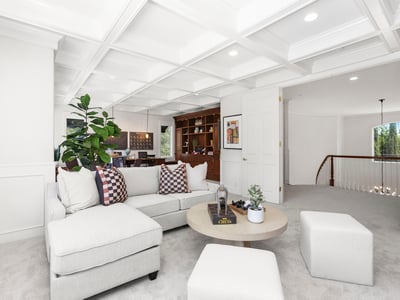 Stunning Coffered ceilings welcome you into the perfect entertaining space with room for a movie night, games party or even space for work/school desk and more (includes TV)
