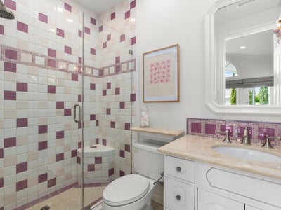 Bedroom 4-Private En-Suite Bath featuring a unique tile design, modern fixtures, and a spacious glass shower.