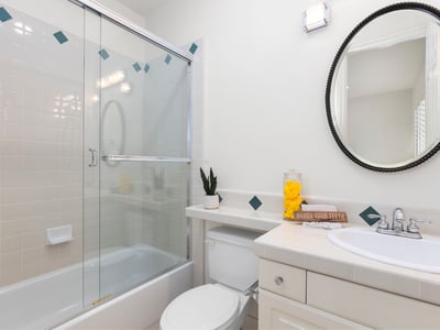 Bedroom 5's private en-suite bathroom featuring modern fixtures and a practical layout for everyday convenience.