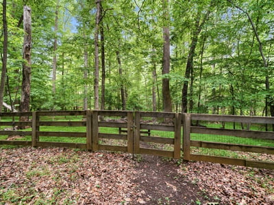 Explore this private wooded lot, ideal for creating your dream home amid nature's tranquility.