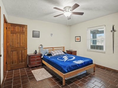 First bedroom, located off of the foyer, with has two doors to access it. One door is across from the guest bathroom for easy accessibility, while the other door is off of the foyer.