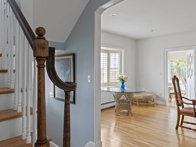 Welcoming foyer leads to an airy dining area, featuring natural light and quality craftsmanship throughout.