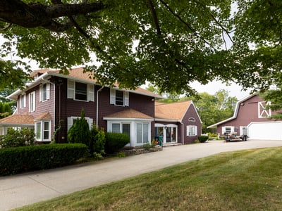 Spacious two-story home with modern amenities, a large yard, and a separate garage for ample storage.