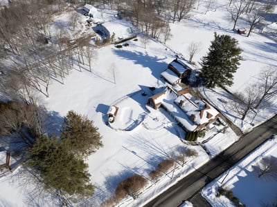 Discover a spacious property with expansive outdoor areas, surrounded by winter wonderland views and tranquility.