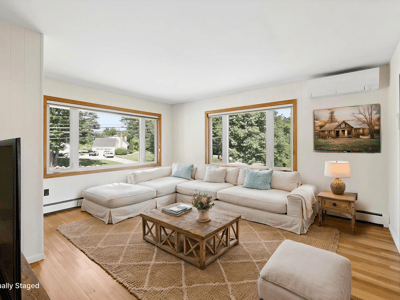 Bright, open living space with expansive windows, perfect for relaxation and enjoying natural light.