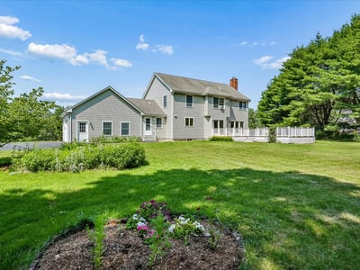 Spacious home featuring a large yard, perfect for outdoor activities and entertaining in a tranquil setting.