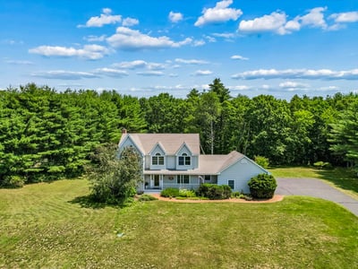 Spacious home on a large lot, surrounded by lush greenery and offering ample outdoor space.