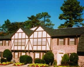 Discover this unique townhouse featuring distinctive architecture, vibrant landscaping, and a welcoming community atmosphere.