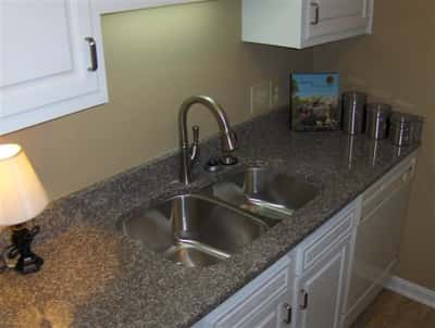 Bright kitchen featuring modern appliances, ample counter space, and a functional layout perfect for culinary enthusiasts.