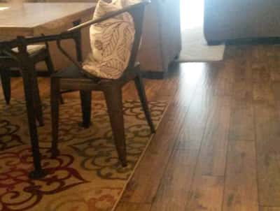Bright and inviting living space featuring warm wood floors and a spacious dining area for gatherings.