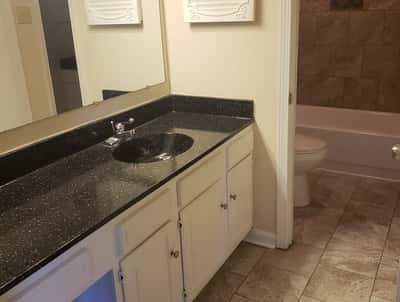 This updated bathroom features modern fixtures and a spacious layout, perfect for everyday comfort.