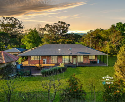 Spacious home set on lush grounds, featuring expansive outdoor areas and stunning views of the landscape.
