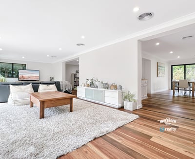 Bright and airy living space with natural light, featuring hardwood floors and an inviting, open layout.