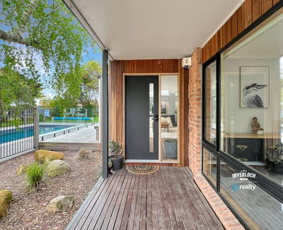 Discover modern living with a seamless indoor-outdoor flow, featuring a sleek entry and inviting surroundings.
