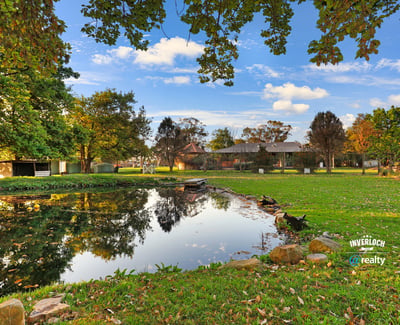 Discover a picturesque waterfront property surrounded by lush greenery and ample outdoor space for relaxation.
