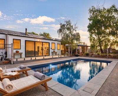 This modern home features a private pool and spacious outdoor area, perfect for entertaining and relaxation.