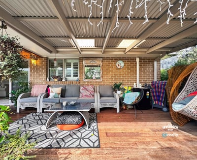 Inviting outdoor space featuring comfortable seating, vibrant decor, and a cozy atmosphere for relaxation and entertainment.