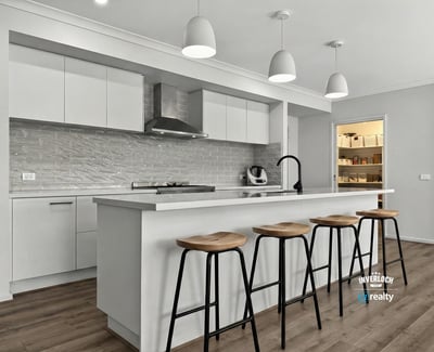 Spacious kitchen featuring modern appliances, a large island, and ample storage for culinary enthusiasts.