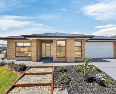 Spacious single-level home featuring modern architecture and easy-maintenance landscaping, set in a desirable neighborhood.