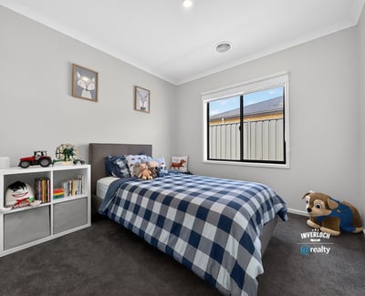 Bright, inviting bedroom featuring cozy decor, natural light, and ample space for personal touches.